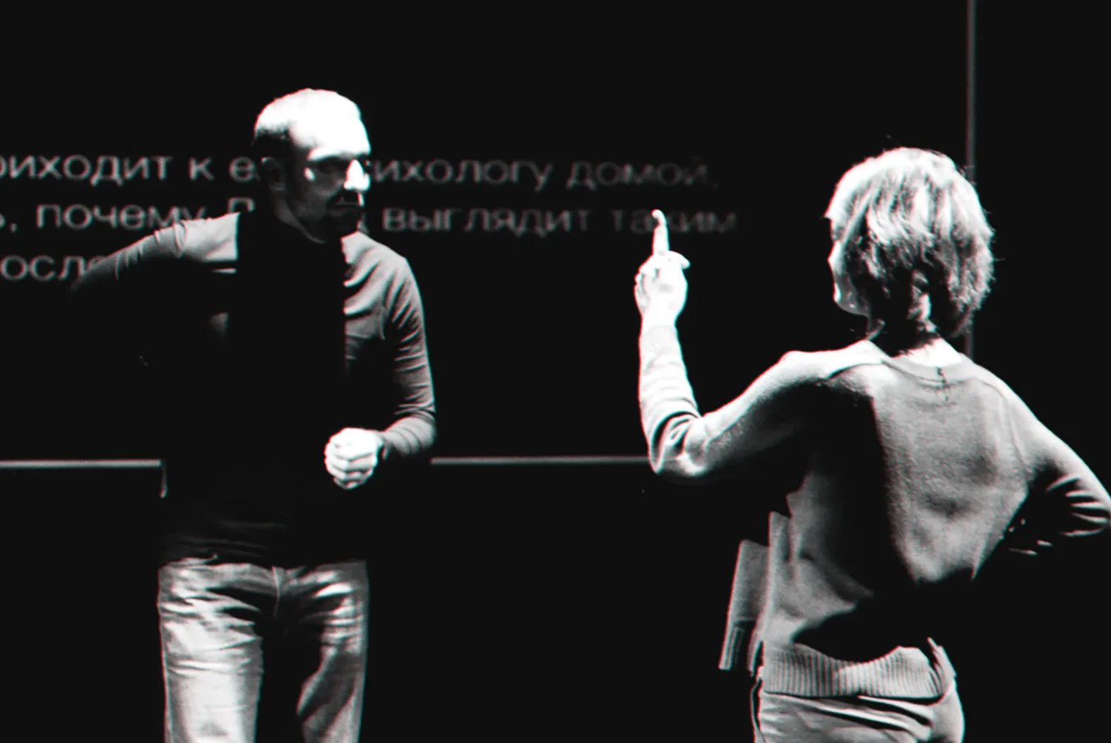 A game master explains a scene to a participant