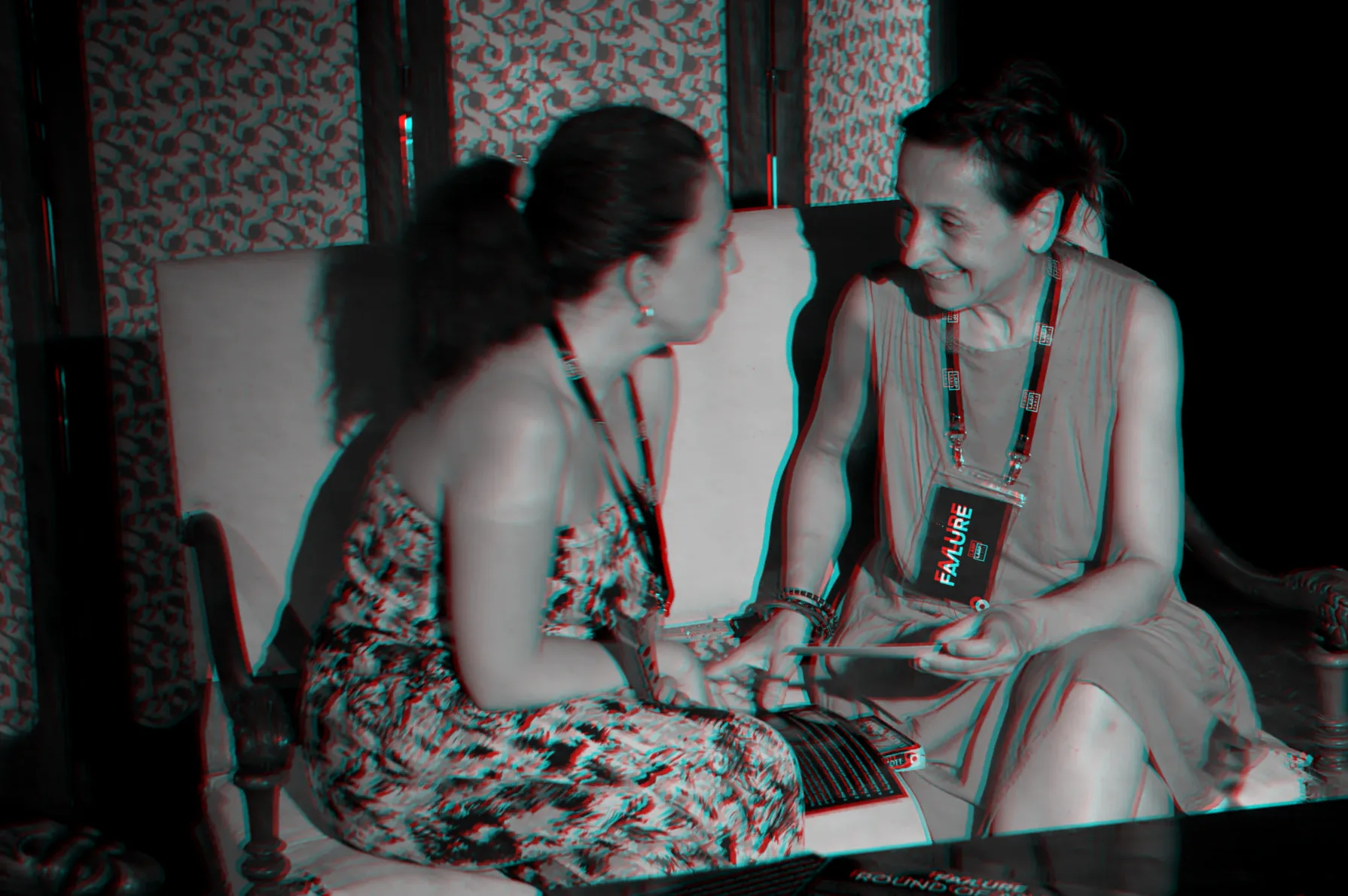 Two participants talking on a sofa