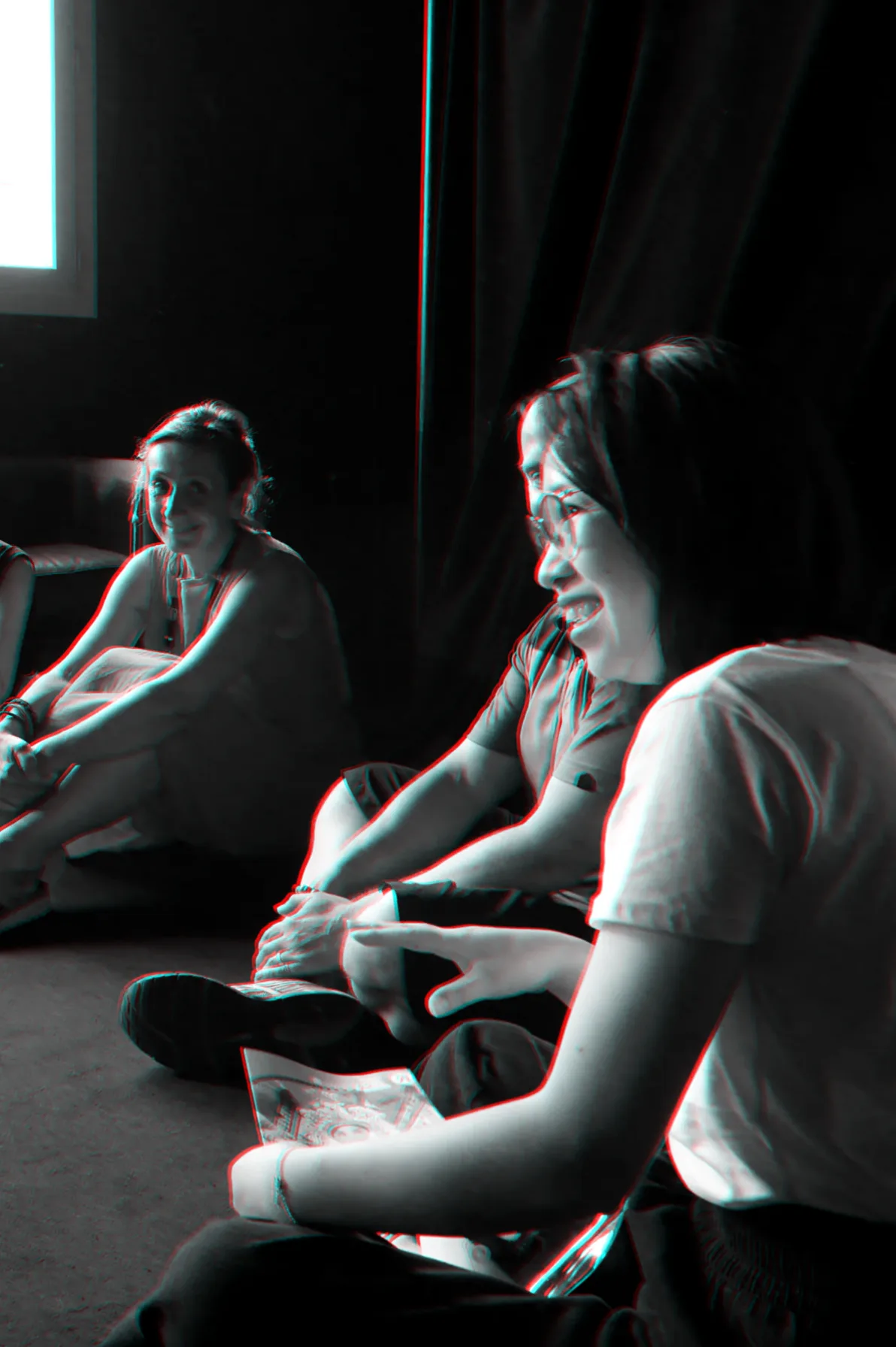 Participants sitting on the floor, talking