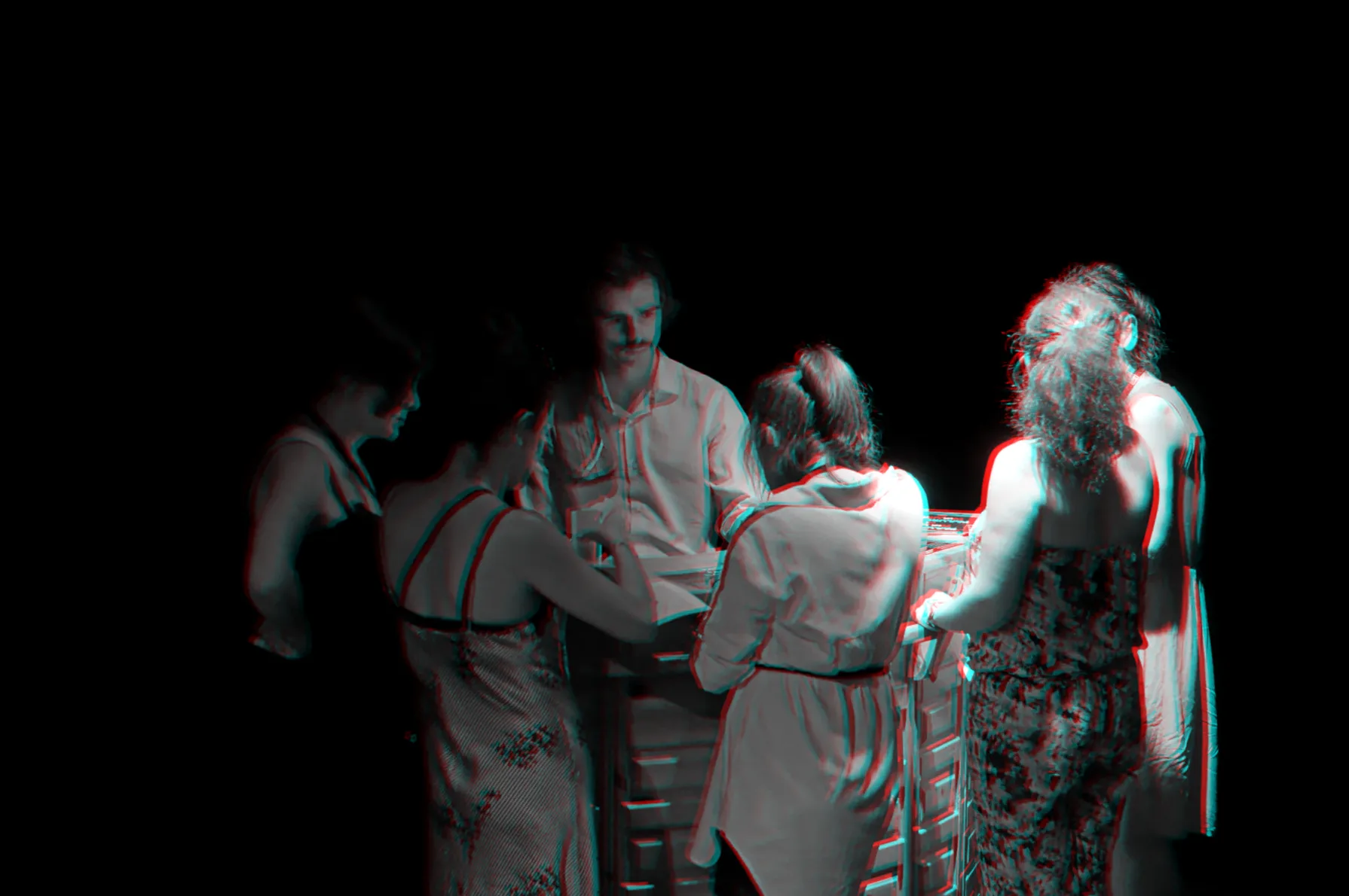 Participants gathered around a cabinet