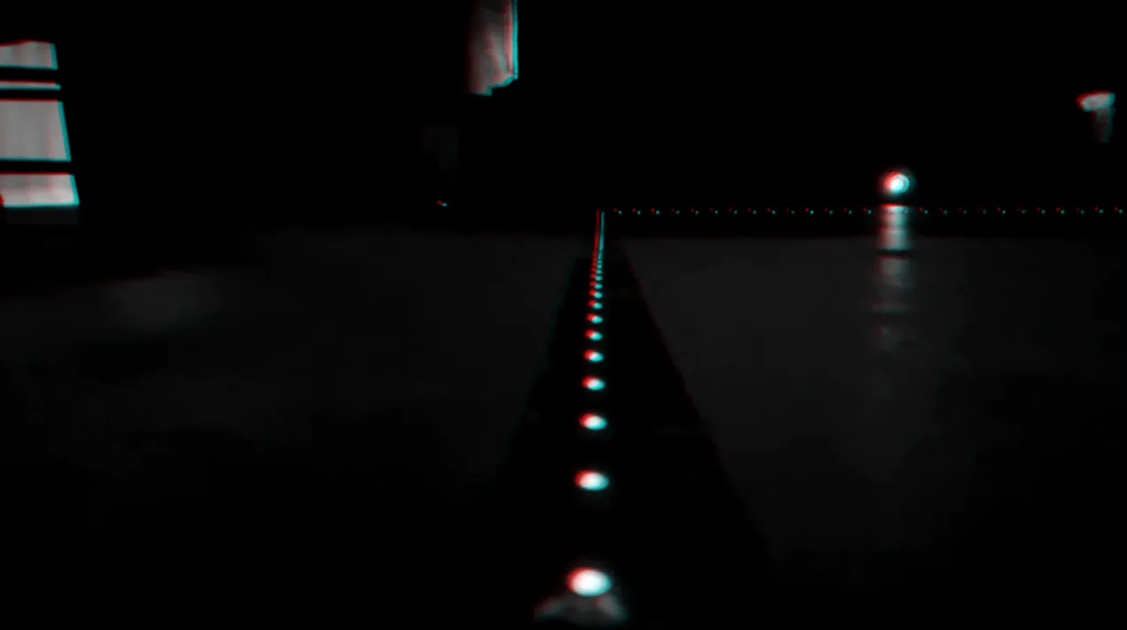 A line of blue lights running across the floor