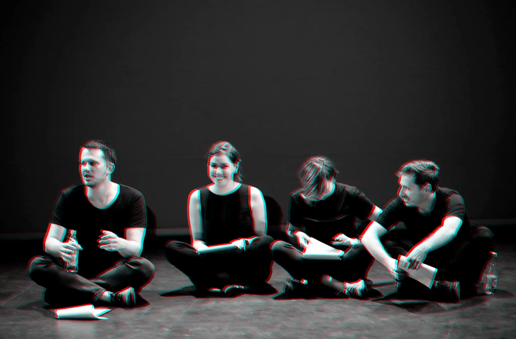 Four participants sitting on the floor